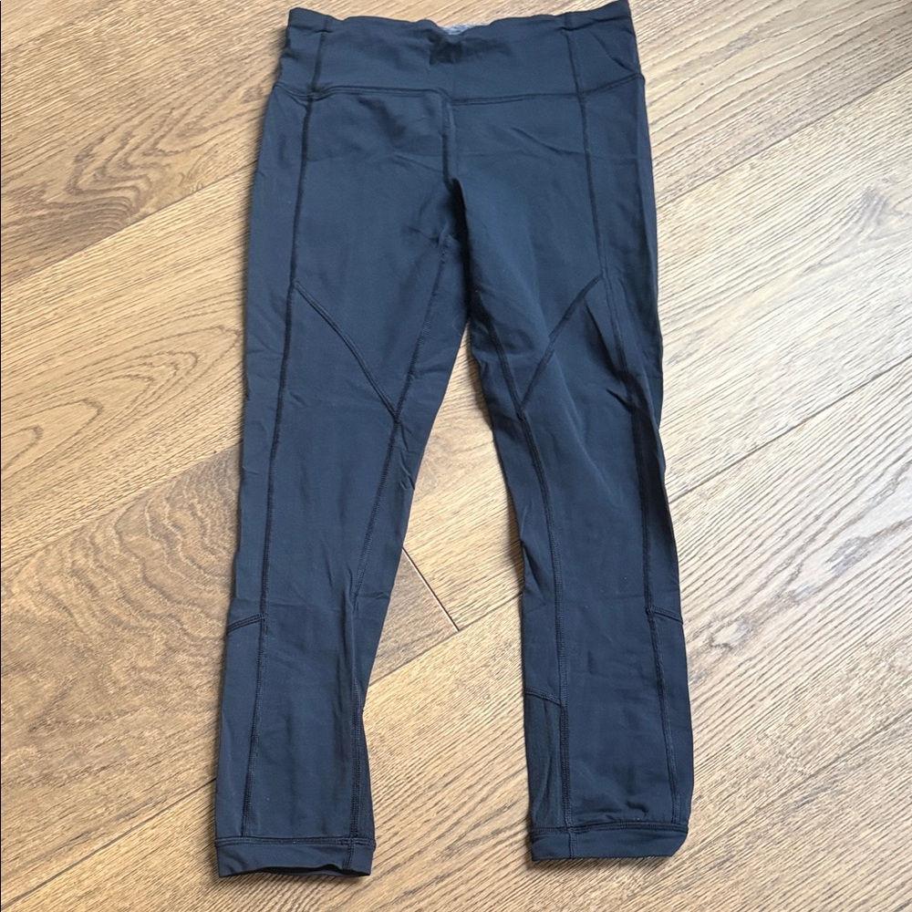 Lululemon 25” leggings with slight frill on the back of the leg around zipper